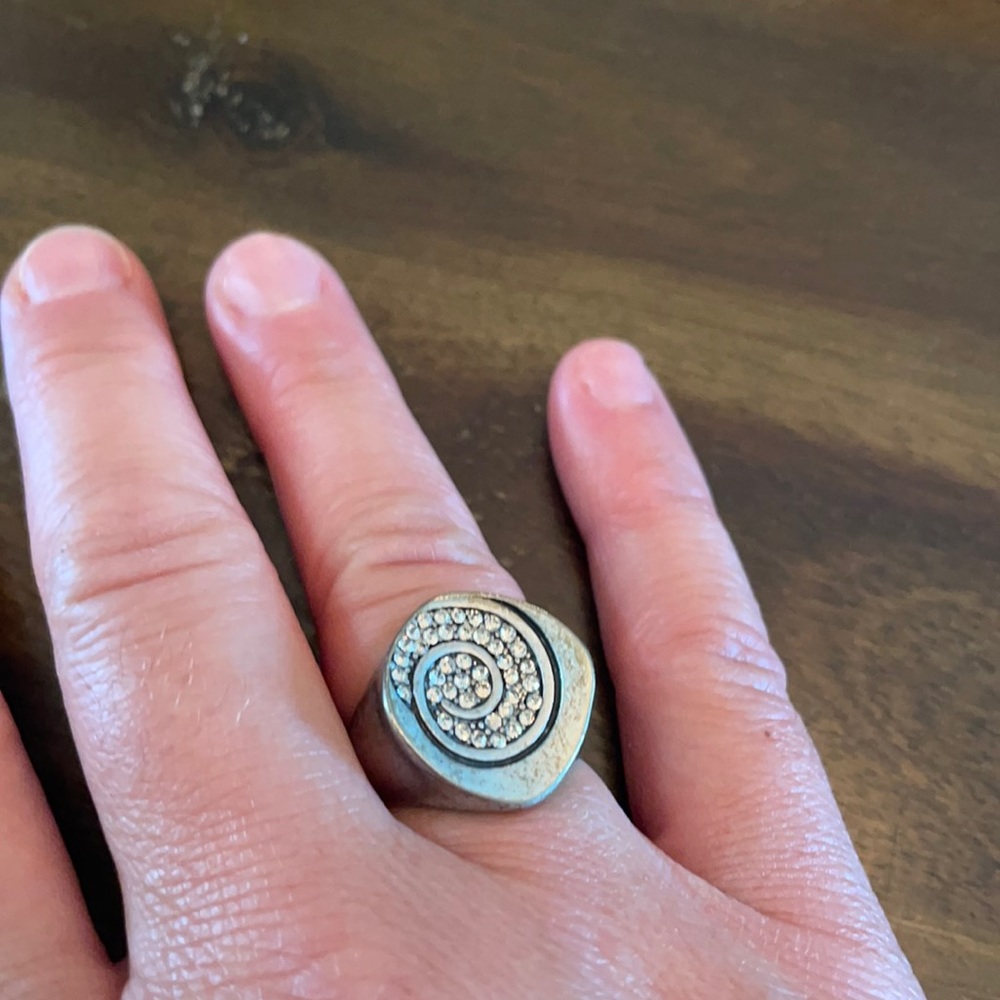 Silver ring with rhinestone swirl